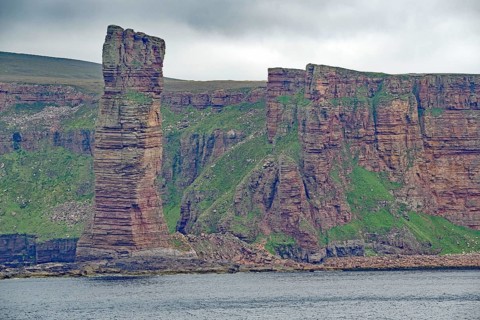 Imposing rock formations on a coastline look dramatic and sublime, Old Men of Hoy, landmark, Orkney
