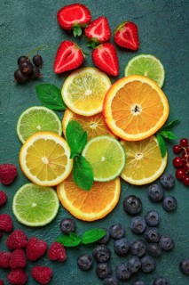 Mix of fruits and berries, set, assortment, sliced citrus fruits, raspberries, blueberries, mint
