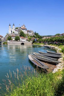 Aarburg town on the River Aare with church, fortress and boats in Aarburg, Switzerland