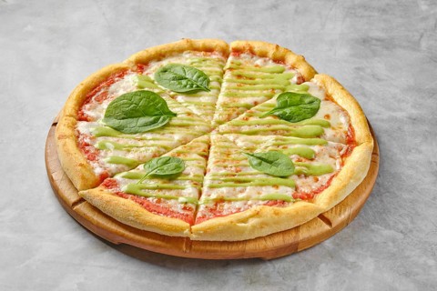 A vegetarian pizza showcases a golden crust topped with tomato sauce, melted cheese, and vibrant