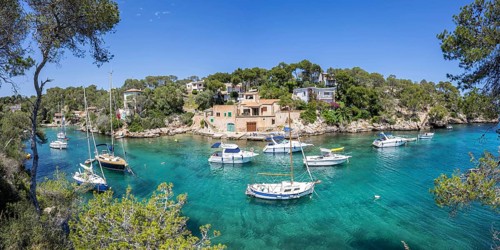 Bay of Cala Figuera on Majorca with boats panoramic holiday by the sea trip in Cala Figuera, Spain