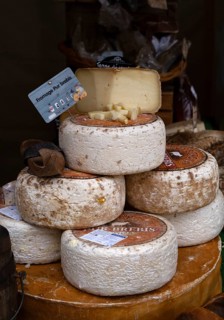 Display, offer, cheese, various cheeses, food, at the medieval market, Bayeux, Normandy, Calvados,