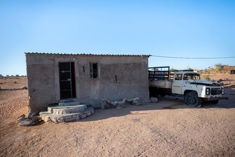 Simple house and old transport vehicle in a small village, Erongo, Damaraland, Namibia