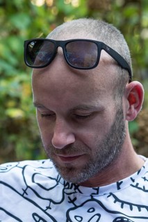 Young man with beard and sunglasses on forehead, Germany