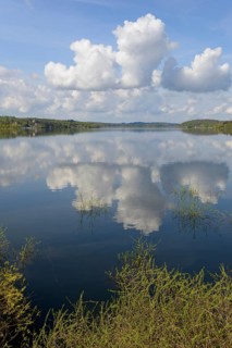 View over the Möhnesee, blue cloudy sky, reflection on the water surface, Möhnetalsperre, North