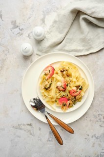 Delicious fettuccine allo Scoglio features an array of seafood mixed with pasta, presented