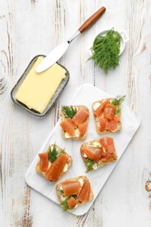 Delicious smoked herring caviar layered on cream cheese spread over crusty bread slices, topped
