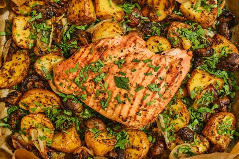 Juicy roasted turkey breast is perfectly cooked and garnished with fresh herbs, surrounded by