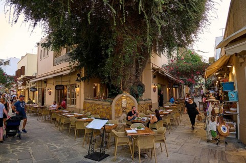 Ifestou Alley, A cosy alleyway café in a narrow alley under a large tree, Kos Town, Kos,