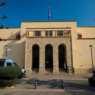 Archaeological Museum, Strict building with stone staircase and Greek flag, Kos Town, Kos,