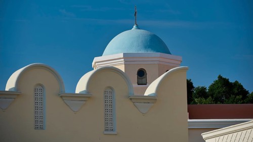 Church, Panagia Agia Paraskevi, detail of a blue dome on a light-coloured building under a blue