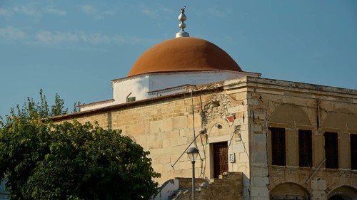 Defter-dar Mosque, Eleftherias Square, Old building with red dome and stone walls under a clear