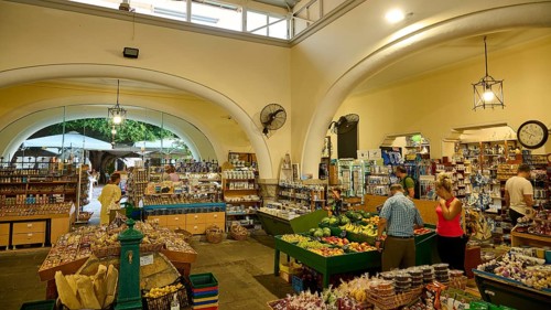 Agora, Municipal market hall, Inner market area with food shops and arches, lively with visitors,