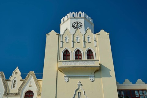 Palace of Justice, colonial building, close-up of a white clock tower with gothic arches against a