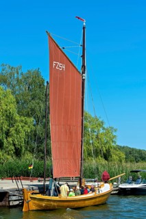 Zeesenboot casting off in Krummin natural harbour, Usedom Island, Mecklenburg-Western Pomerania,