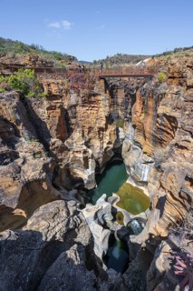 Bridges over a canyon with steep orange-coloured cliffs and the Blyde River, Bourke's Luck