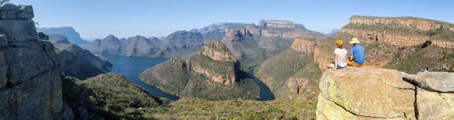 Two hikers enjoying panorama, Blyde River Canyon with Three Rondawels peak, view of gorge with