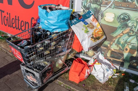Shopping trolleys and carrier bags overflowing with empty beer bottles on the mountain, Erlanger