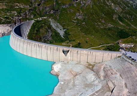 Impressive arch dam of the Moiry reservoir, Lac de Moiry, at low water in summer, Val d'Anniviers,