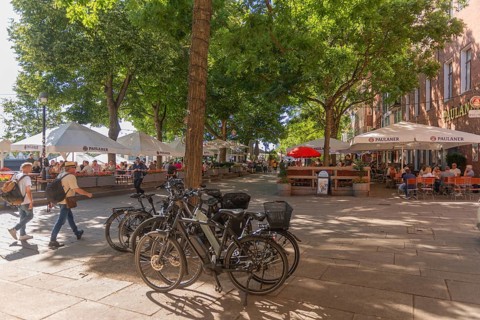 The Schlachte, historic riverside promenade along the Weser with restaurants and cafés in the shade