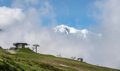 Ski lift in the Domaine de Balme ski area at Col de Balme, in summer, behind the summit of Mont