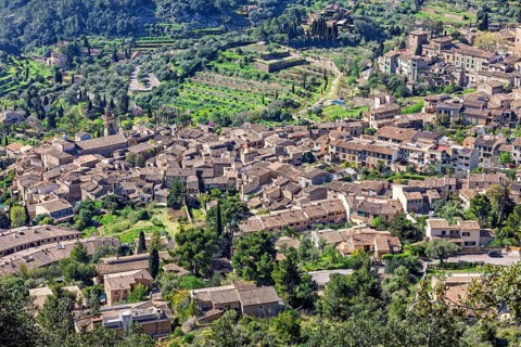 Aerial view at a mountain village with old houses in a valley, Valldemossa, Mallorca, Spain