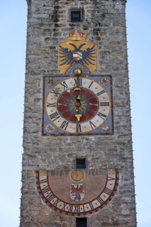 Colourful tower clock with coat of arms and sundial, Zwölferturm, historic old town, Sterzing,