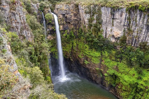 High waterfall in a canyon, Mac-Mac Falls, long exposure, near Graskop, Mpumalanga, South Africa