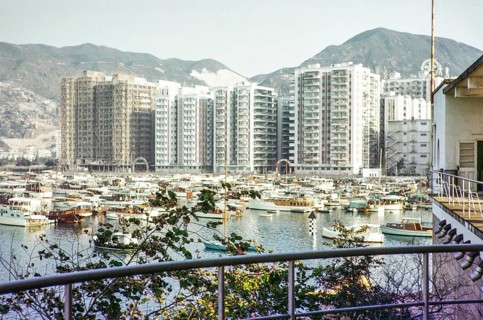 High rise apartment buildings and boats including yachts view from Royal Hong Kong Yacht Club,