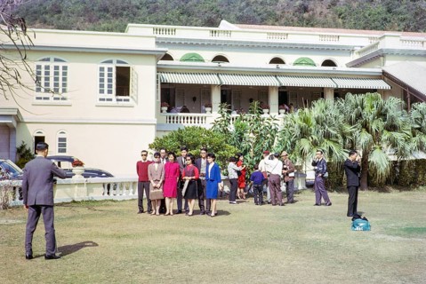 People taking family photos in garden of Repulse Bay Hotel, Repulse Bay, Hong Kong, Asia 1964