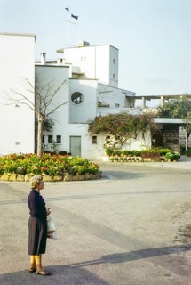 European woman standing next to Royal Hong Kong Yacht Club, Kellet Island, Causeway Bay, Hong Kong,