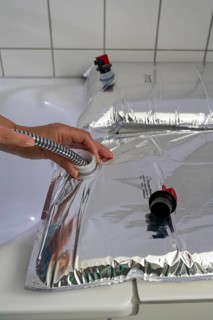 Filling a 10 litre water bag, for storing drinking water at home, as an emergency reserve in the