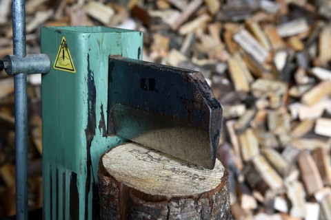 Firewood, splitting with a log splitter, axe