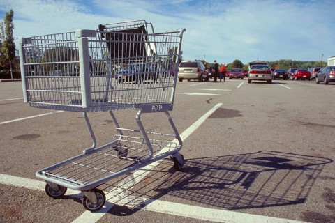 Empty shopping trolley in the car park of a supermarket, New Jersey, USA