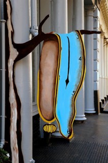 Entrance sign of an art gallery with a Salvadore Dali motif in downtown, New York City, USA
