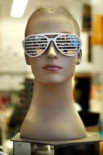 Female mannequin with sunglasses at an optician, New York City, USA