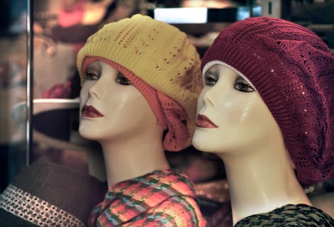 Female mannequins with knitted hats, New York City, USA