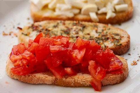 Fresh bruschetta with chopped tomatoes on toasted bread, flavoured with herbs and spices, Tuscany,