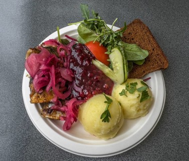 Typical Swedish meal: Fried herring with mashed potatoes, lingonberry jam, bread and vegetables
