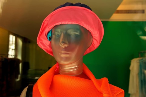 Female mannequin made of transparent plastic with floppy hat, New York City, USA