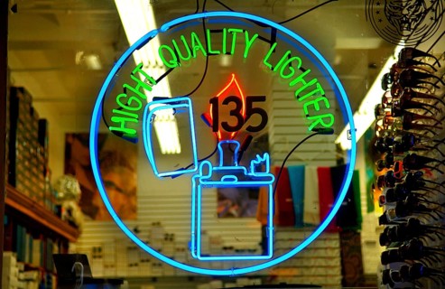 Illuminated advertising in a lighter shop, New York City, USA