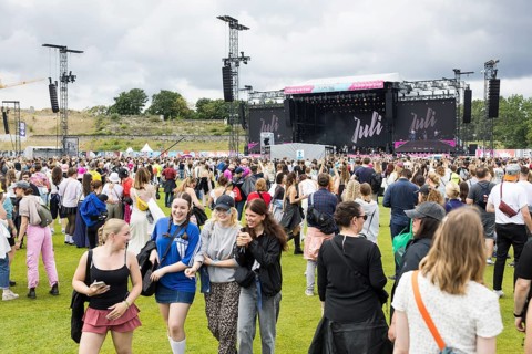 Festival visitors in front of the concert of the band Juli at the Lollapalooza Festival in the