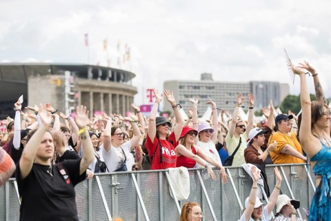 Festival visitors in front of the Olympic Stadium at the Lollapalooza Festival in the Olympic