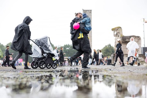 Festival visitor with child at the Lollapalooza Festival in the Olympic Stadium and on the Maifeld,