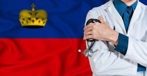Doctor with stethoscope on Liechtenstein flag. Doctor holding stethoscope on Liechtenstein flag