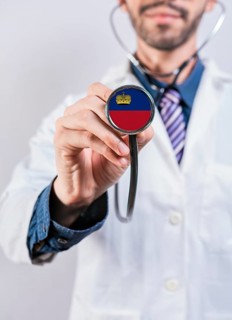 Liechtenstein health and medical insurance concept. Liechtenstein healthcare system, doctor holding