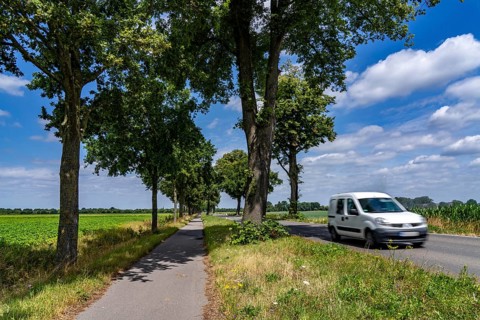 Country road south of Kampen, on the Lower Rhine, with side cycle and footpath, North