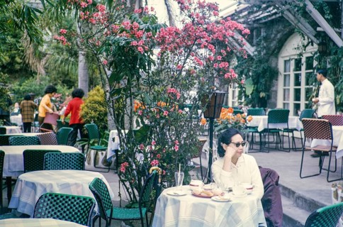 Woman sitting at table of restaurant at the Peak, Hong Kong, Asia, 1964