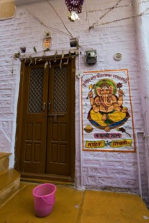 Colourful Ganesha image next to a front door in the fortress of Jaisalmer, Rajasthan, India