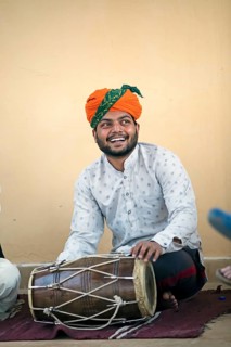 Rajasthani folk musician with a dhol or tubular drum, Jaisalmer, Rajasthan, India